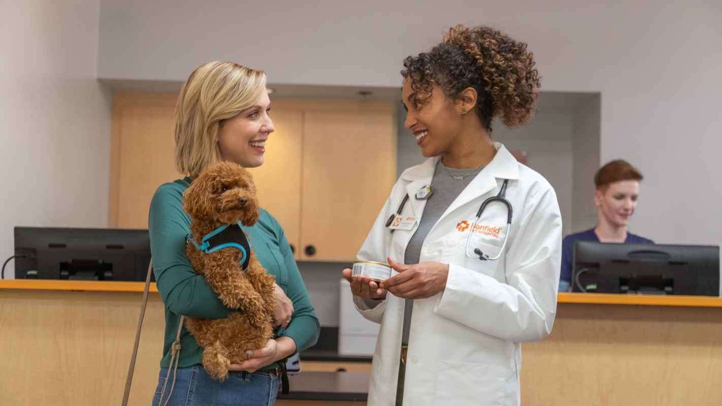 doctor and pets owner discussing